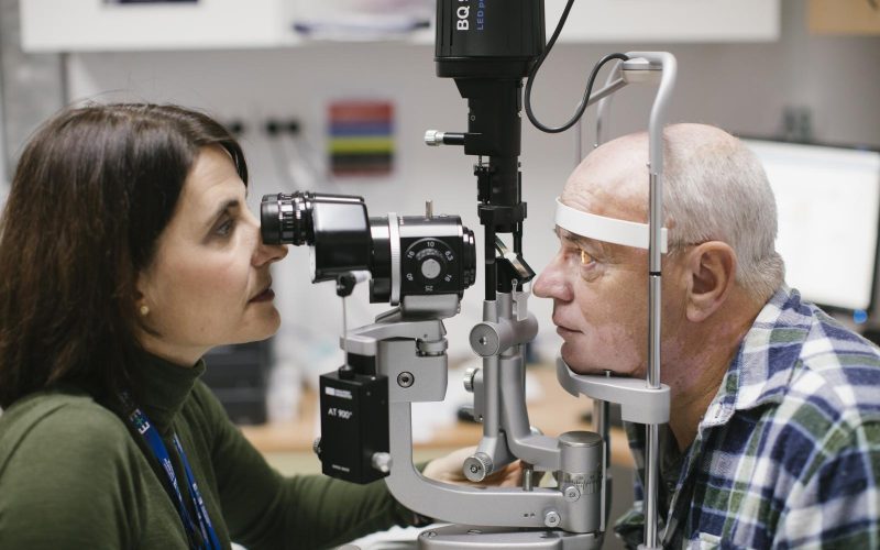Orthoptist testing a patients eye