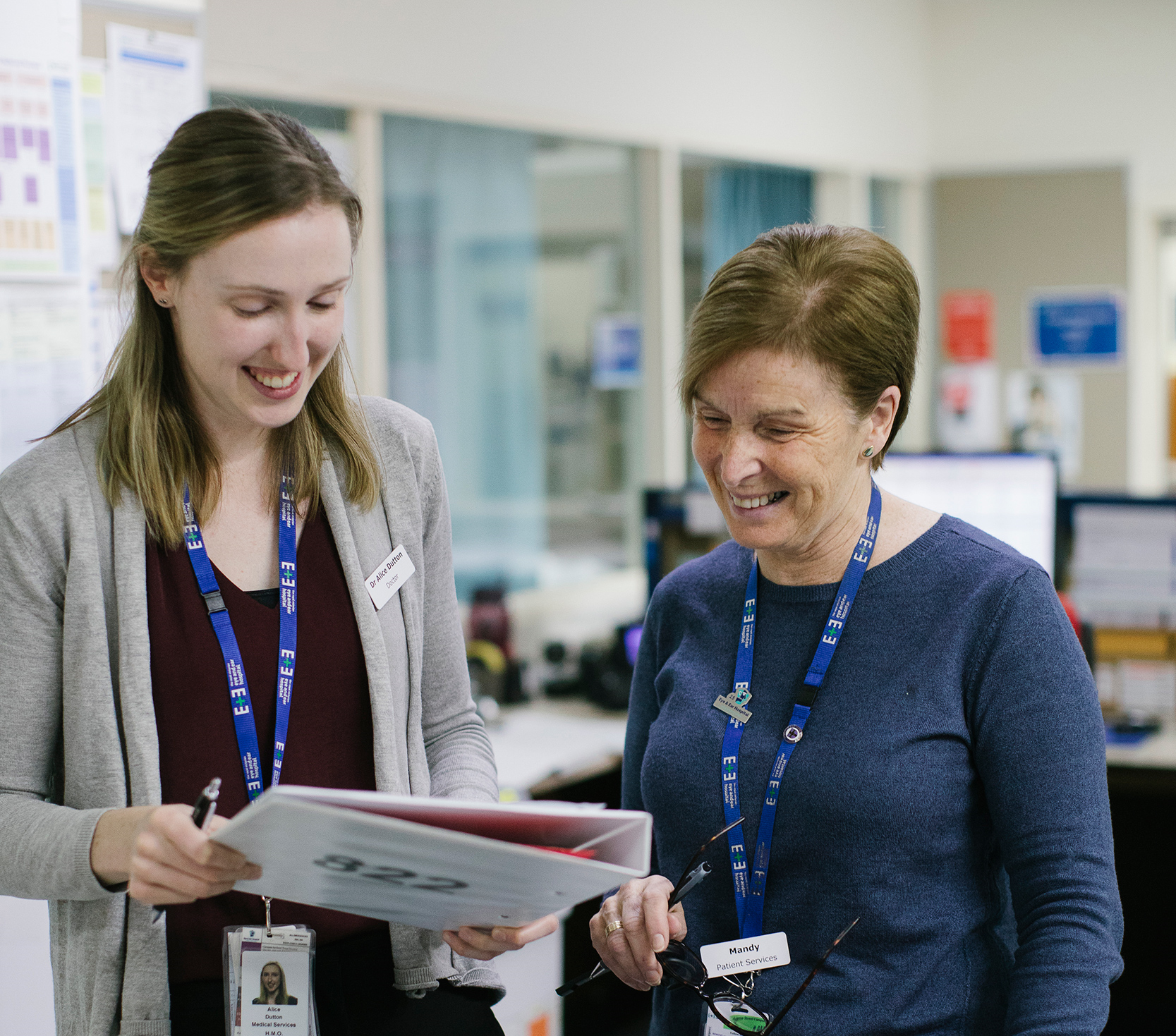 Two medical staff reviewing a document