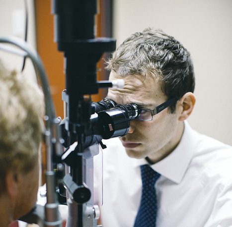 Clinician examining a patients eyes