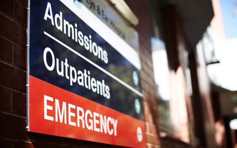 photo of the emergency sign outside the Eye and Ear main site. the sign reads 'Admissions', 'Outpatients' and 'Emergency' each with an arrow pointing towards the hospital