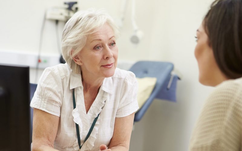 A clinician meeting with a patient