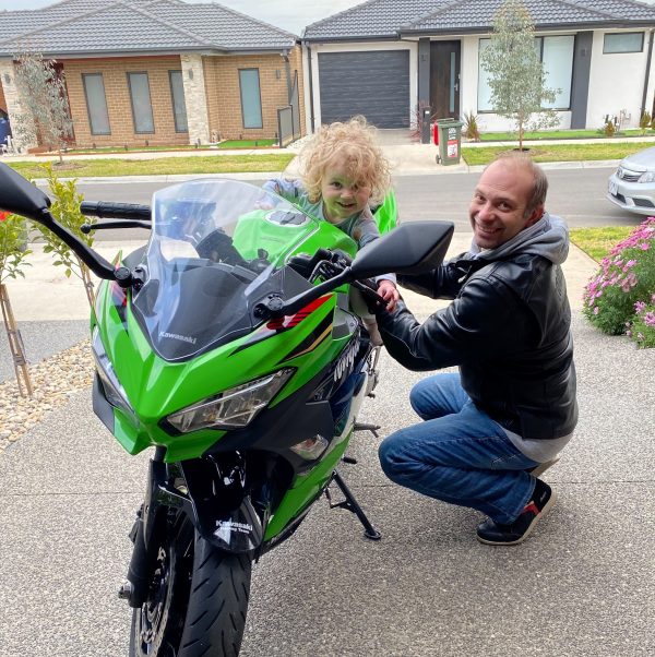 Laurie with youngest daughter and his new motorbike