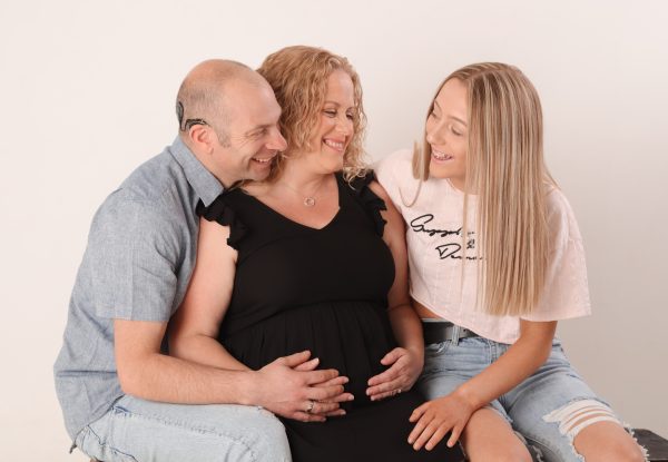 Laurie with pregnant wife and eldest daughter smiling