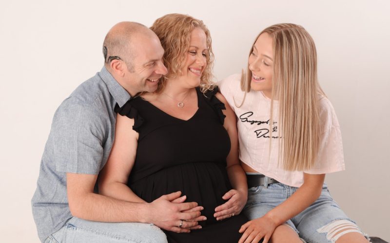 Laurie with pregnant wife and eldest daughter smiling