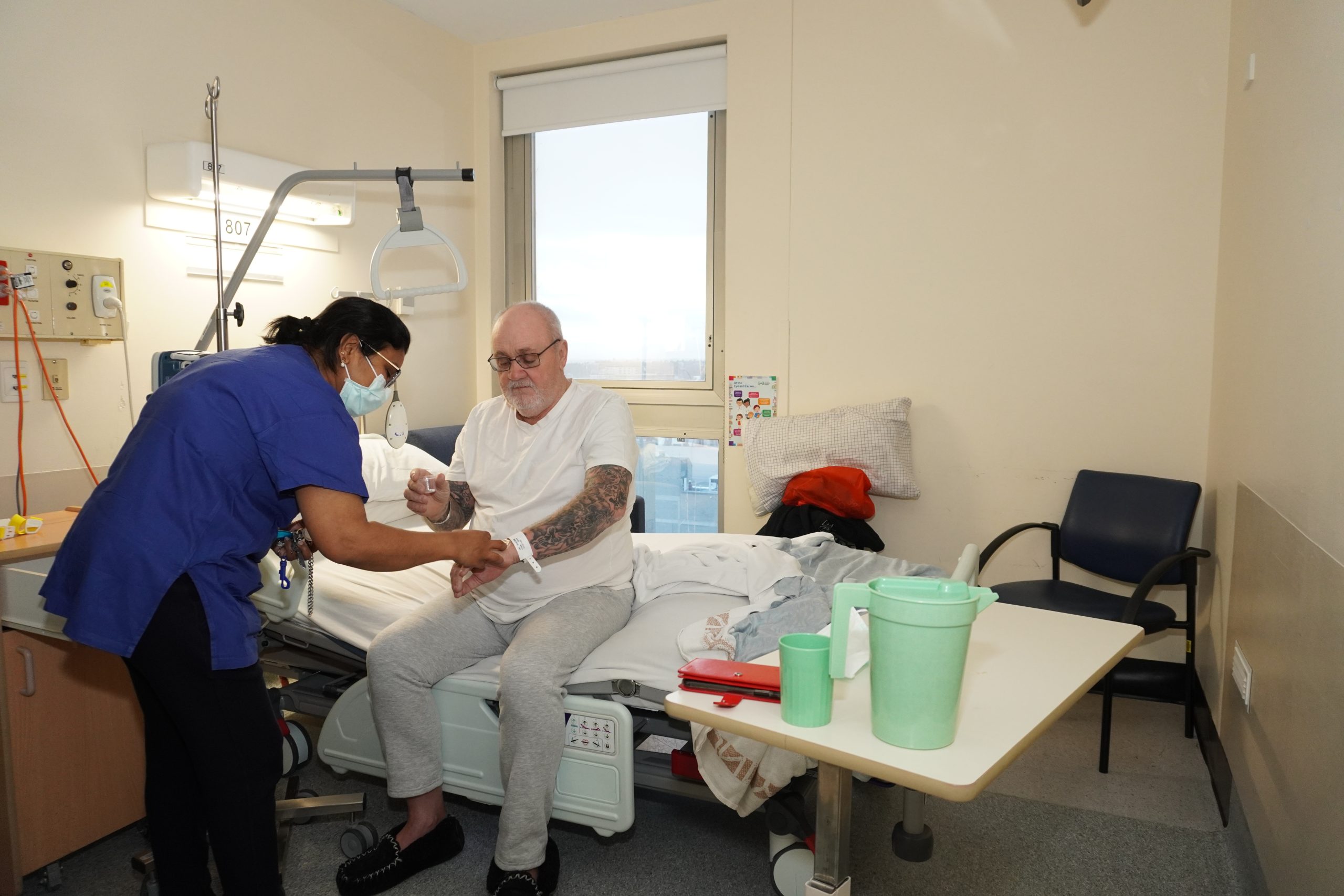 Patient being cared for by nurse in the old Ward 8