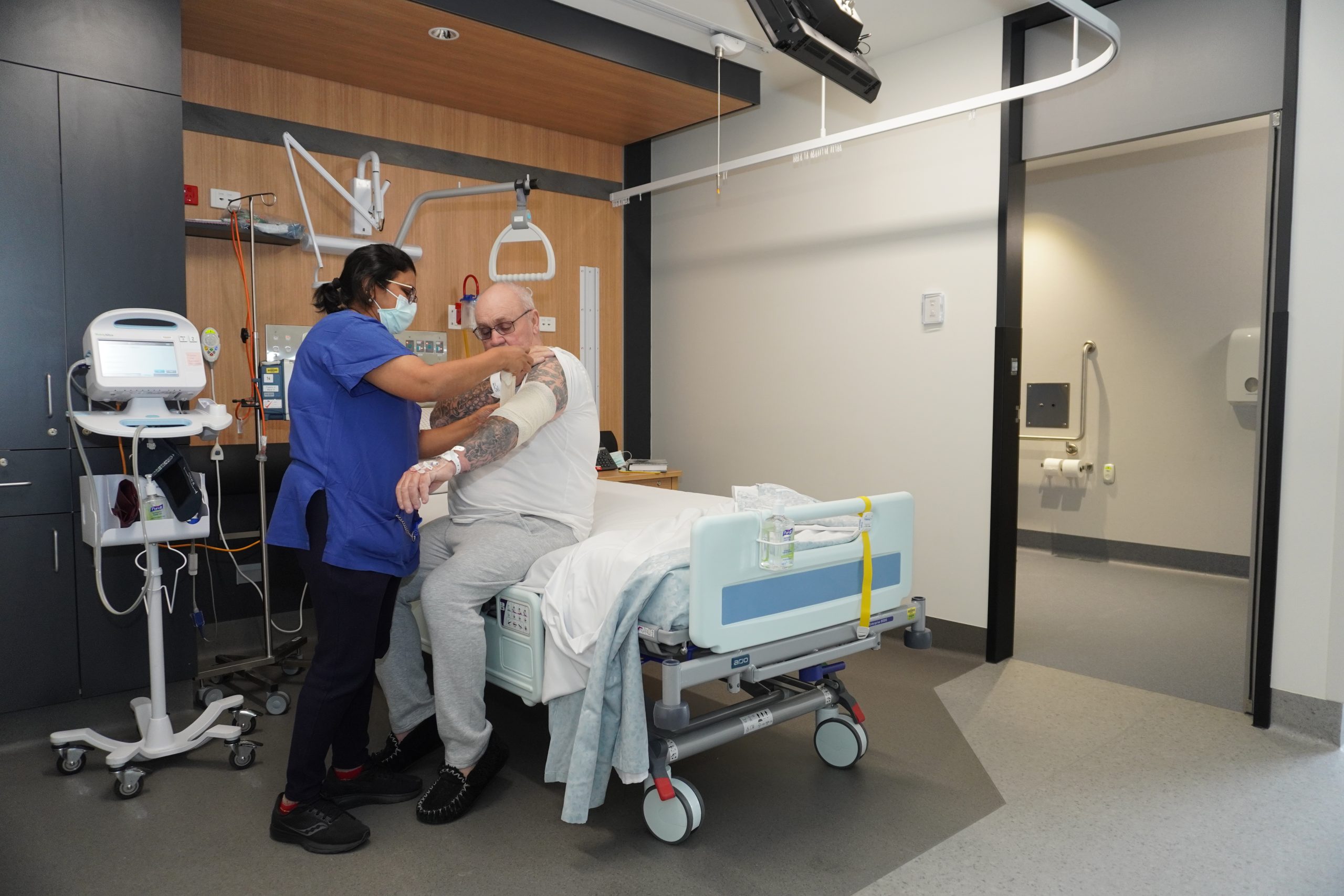 David being cared for in the new Inpatient Ward by an Eye and Ear nurse.