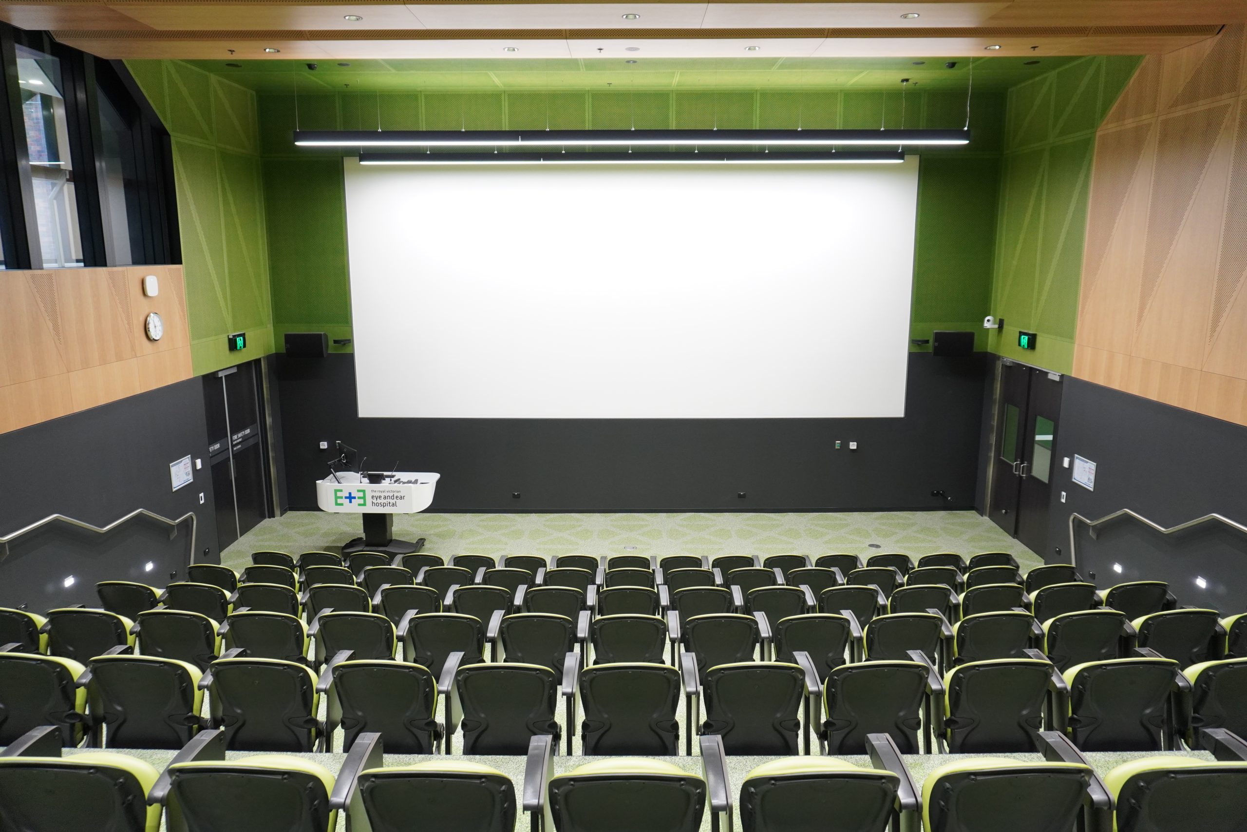 View of the new Martin Family Auditorium from the back looking forwards to the lectern and display