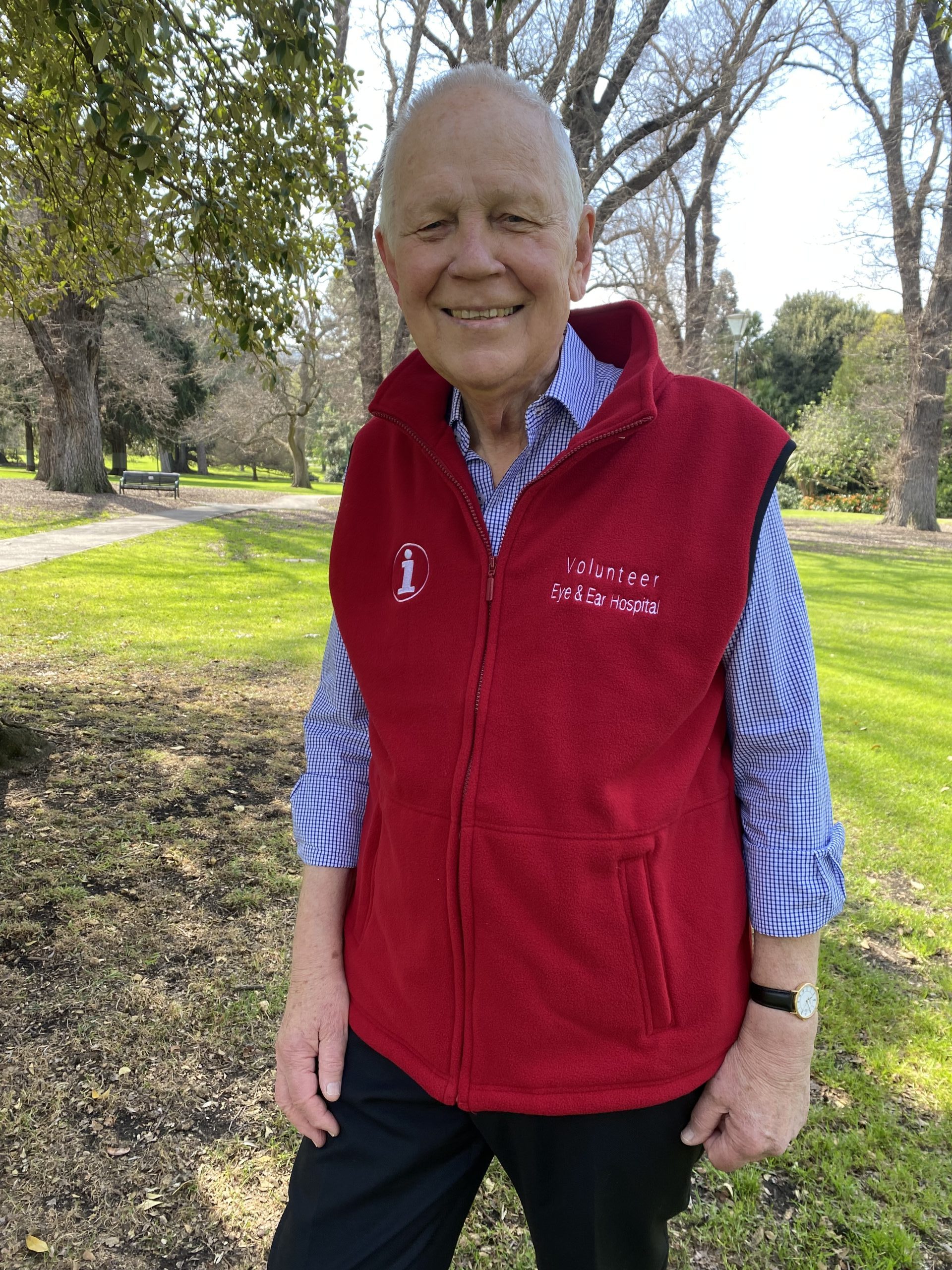 Volunteer Peter Rushen wearing his red volunteering vest