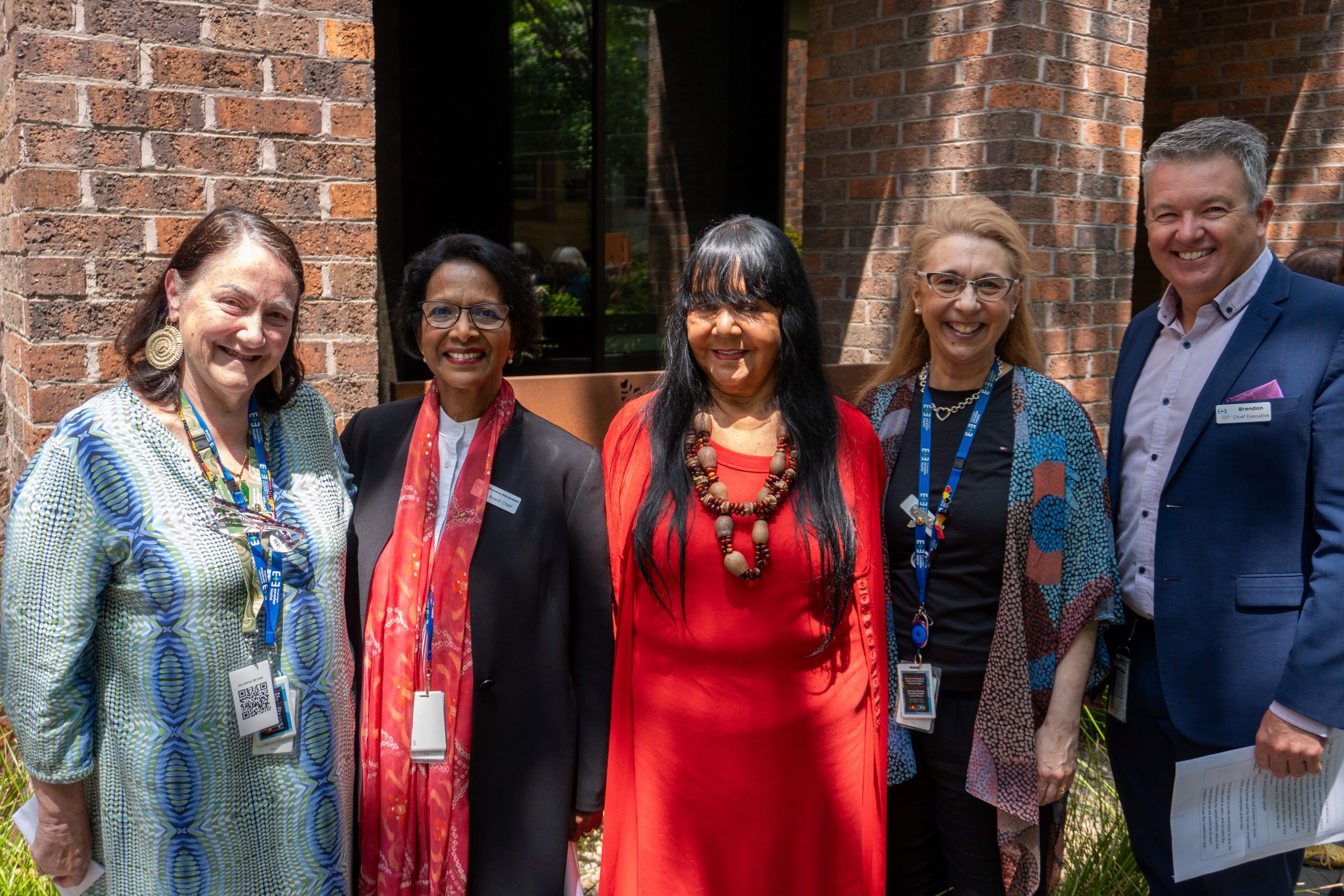 AHLO Carleen Miller, Board Chair Dr Sherene Devanesen, Aunty Zeta Thomson, AHLO Natalie Tieri and CEO Brendon Gardner standing together, smiling