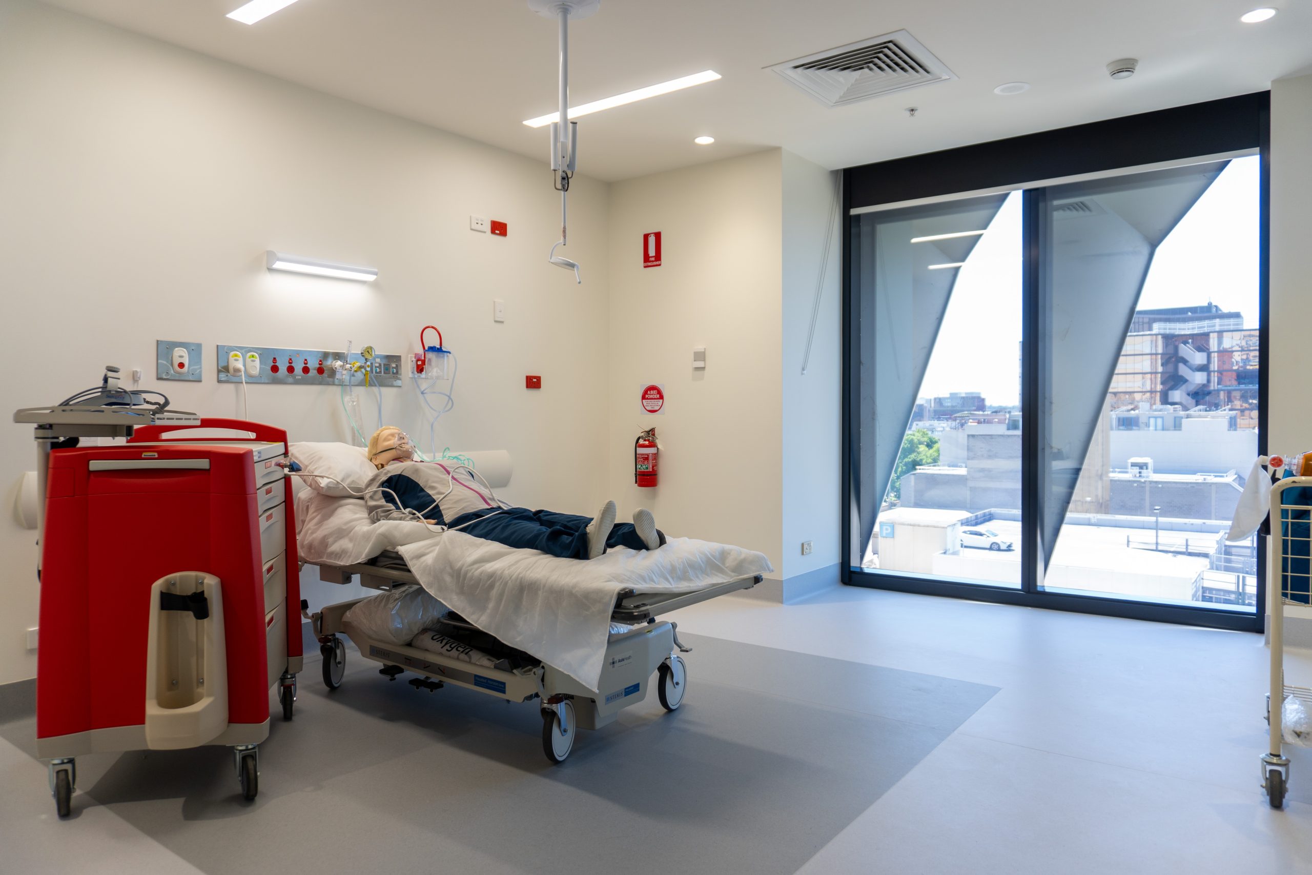 The clinical simulation room equipped with hospital bed, Patient dummy, clinical settings and nurse trolley