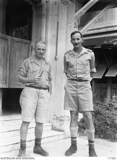 Weary Sunlop standing next to Lieutenant Colonel A. E. Coates in Thailand