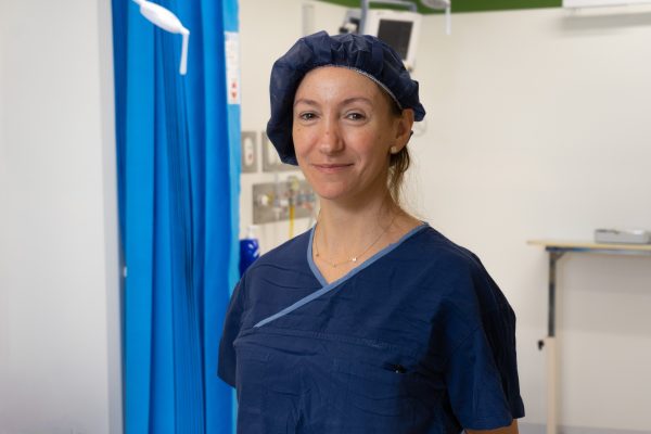Nurse Malissa in Blue scrubs and hairnet in the Surgical Recovery Suite