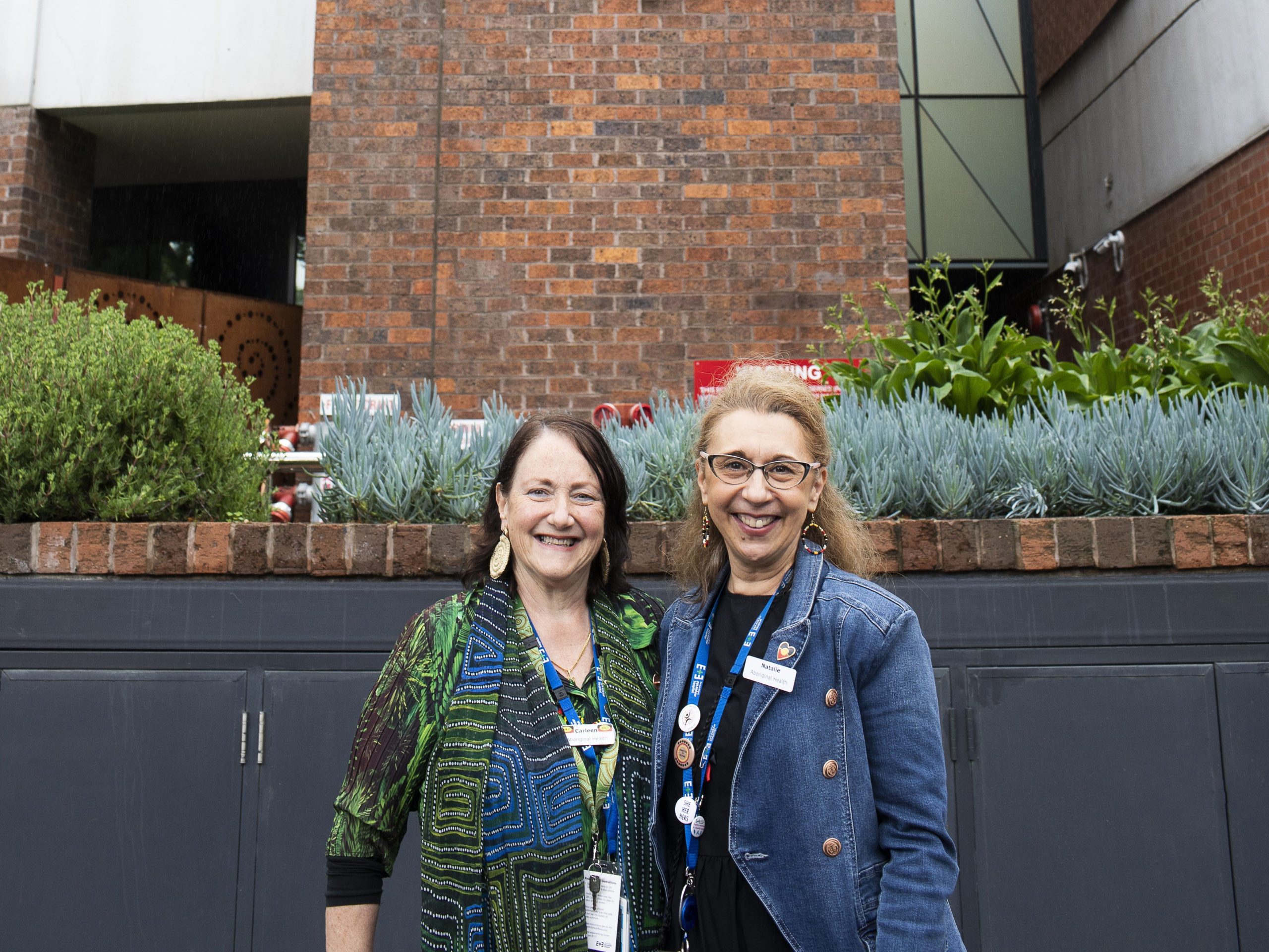 Our Mirring Ba Wirring Team Carleen and Natalie standing together and smiling.