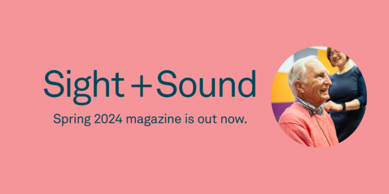 A pink tile with navy text 'Sight + Sound, Spring 2024 Magazine out now'. A photo of an elderly cochlear patient sitting down and smiling during a consult features on the tile.