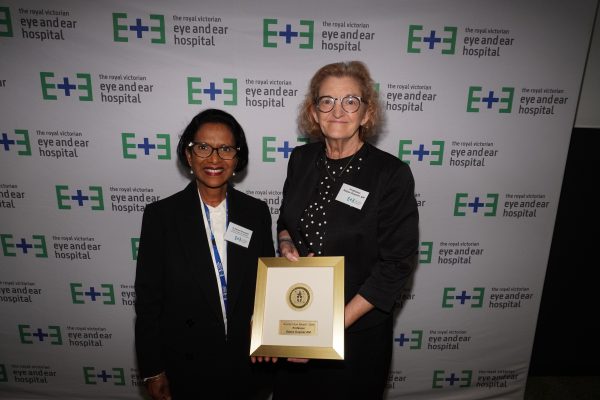 Dr Shrene Devanesen standing next to professor Robyn Guymer AM who holds the Board Chairs Medal