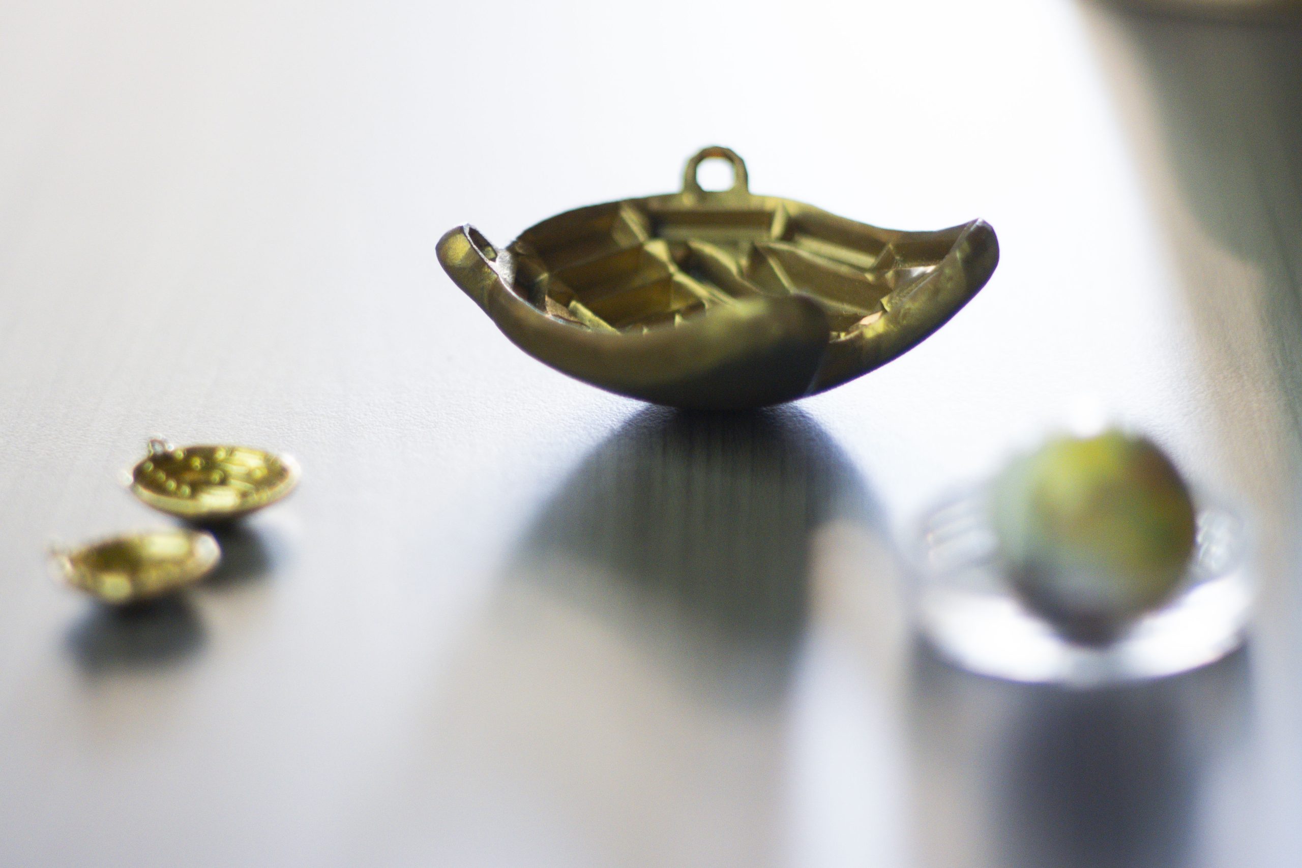 A close up photo of an an eye plaque used to treat ocular melanoma