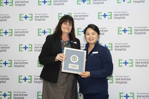 Exec Director of Operations and Chief Nursing Officer, Leanne Turner (left) stands with Nursing Excellence Award Winner Amy Tan holding the winners plaque.