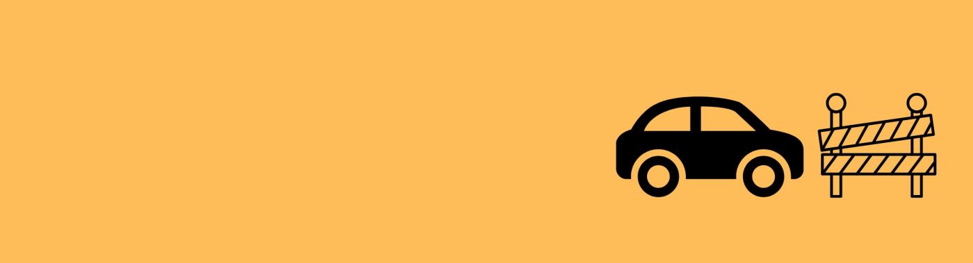 An orange tile with a black car and a barricade in its centre.