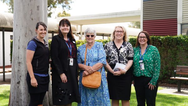 Four people standing next to patient sue from Goulburn Valley Health and the Eye and Ear hospital.