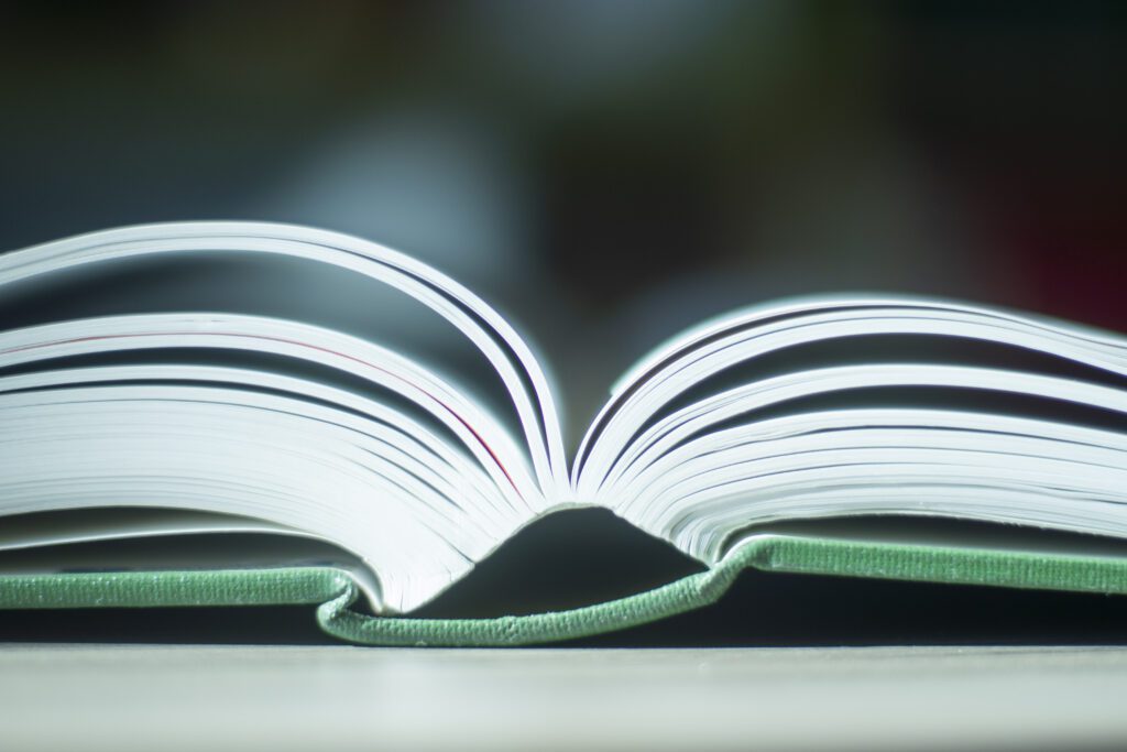 A close up of a book open on a table.